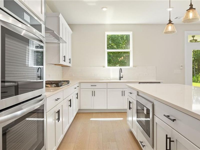 Furnished interior view inside a new home in Melody Lakeside Estates, Buford (Image 6).