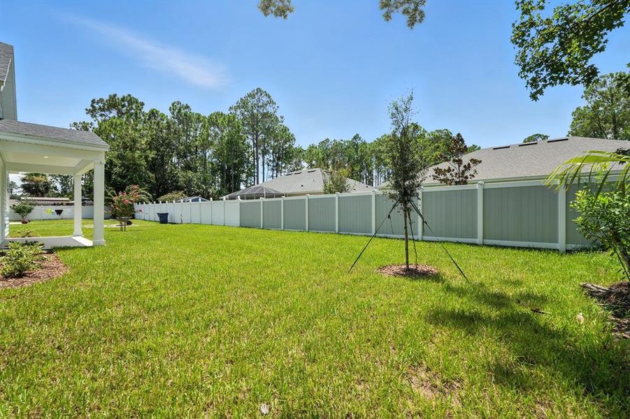 Front exterior of a new home in Palm Coast Homes, Palm Coast, FL, highlighting curb appeal (Image 20).