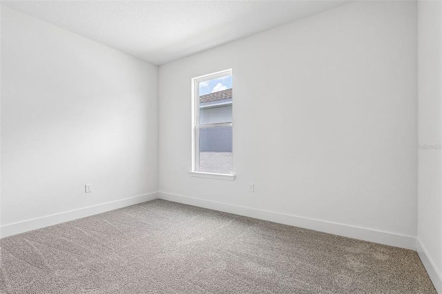 Spacious, unfurnished interior of a new home in Lakeside at Satilla, St. Cloud (Image 18).