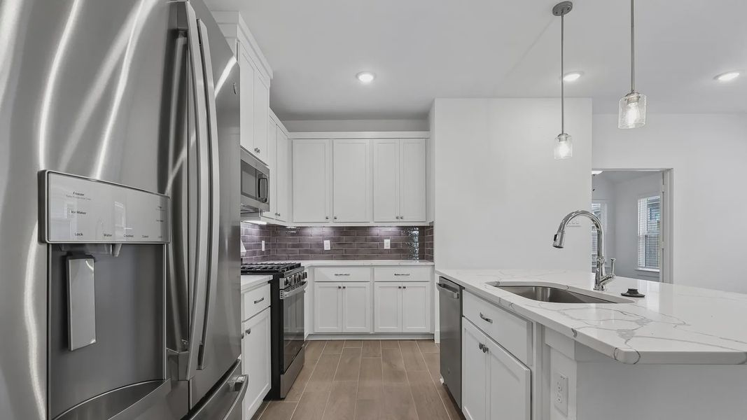 Furnished interior view inside a new home in Meridiana Townhomes, Iowa Colony (Image 8).