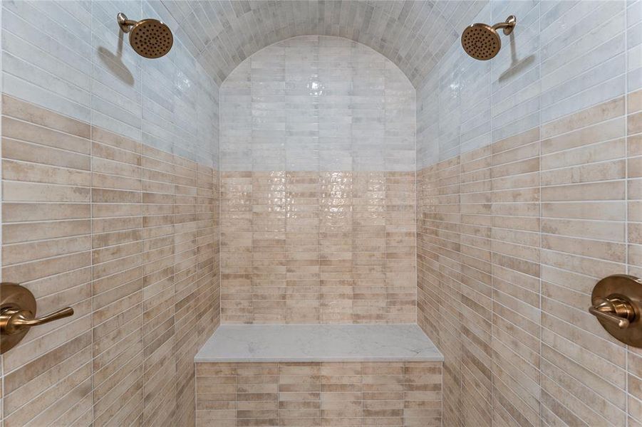 Full bath featuring tiled shower