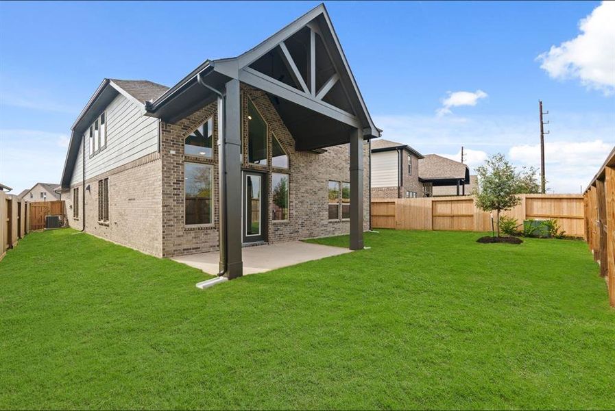 All brick rear elevation with huge, oversized back patio with no back neighbors.