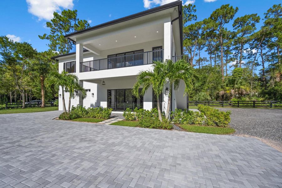 Front exterior of a new home in , Wellington, FL, highlighting curb appeal (Image 29).