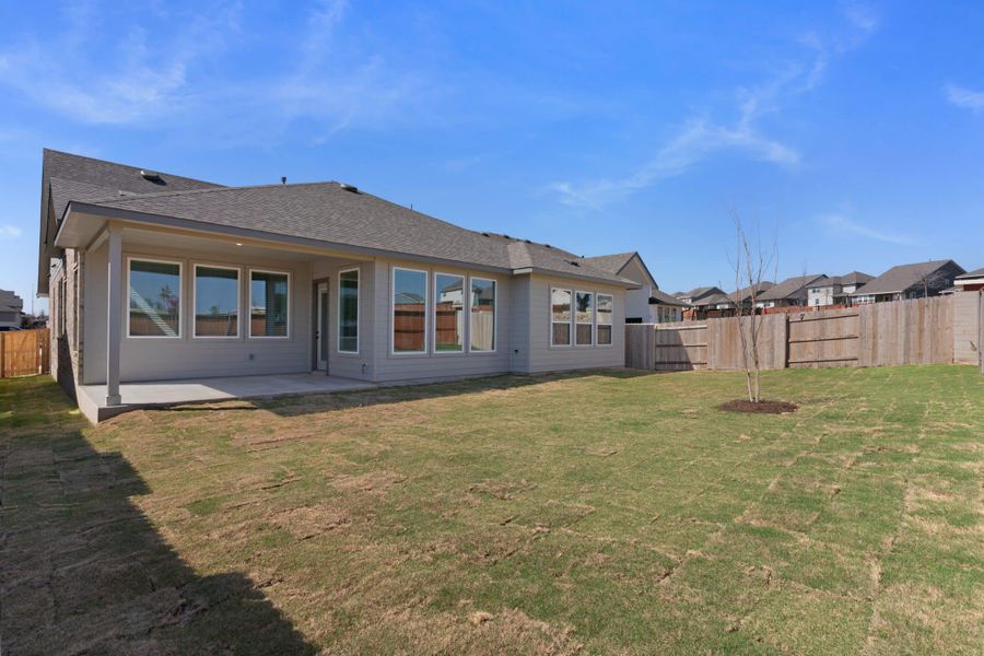 Exterior details and patio area of a home in Lariat, Liberty Hill (Image 21).