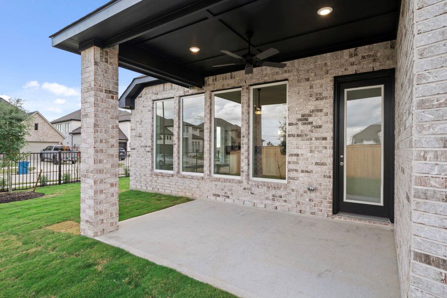 Exterior details and patio area of a home in Bridgeland, Cypress (Image 3).