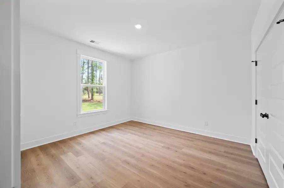 Spacious, unfurnished interior of a new home in Long Bay Golf Club, Longs (Image 28).