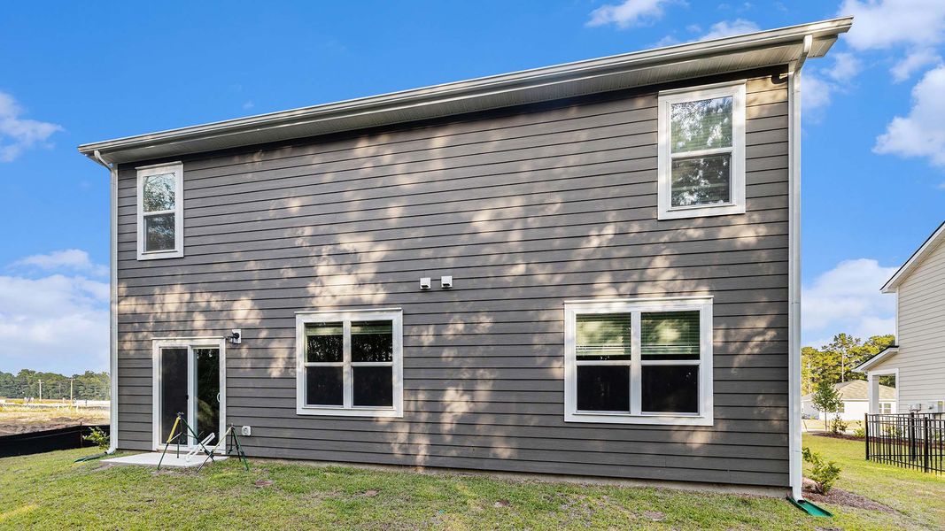 Exterior details and patio area of a home in Auberon Woods, Conway (Image 4). Exterior details and patio area of a home in Auberon Woods, Conway (Image 4).