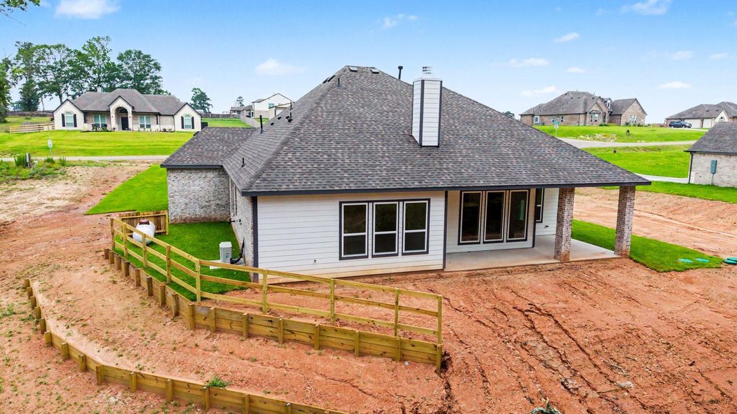 Exterior details and patio area of a home in Rose Hill Estates, Willis (Image 24).