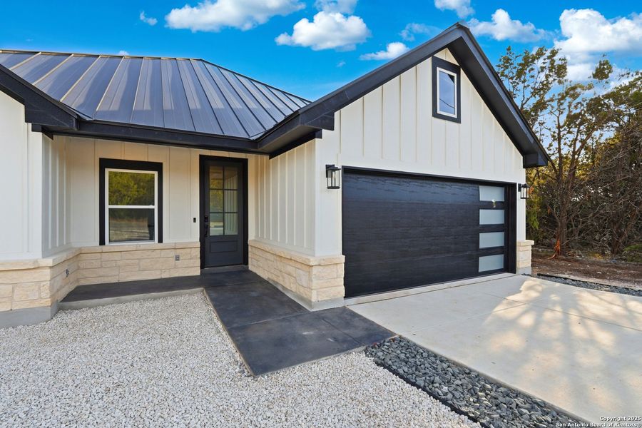 Front exterior of a new home in , Spring Branch, TX, highlighting curb appeal (Image 2). Front exterior of a new home in , Spring Branch, TX, highlighting curb appeal (Image 2).