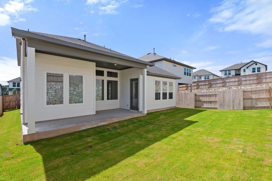 Front exterior of a new home in Park Collection at Lariat, Liberty Hill, TX, highlighting curb appeal (Image 25). Front exterior of a new home in Park Collection at Lariat, Liberty Hill, TX, highlighting curb appeal (Image 25).