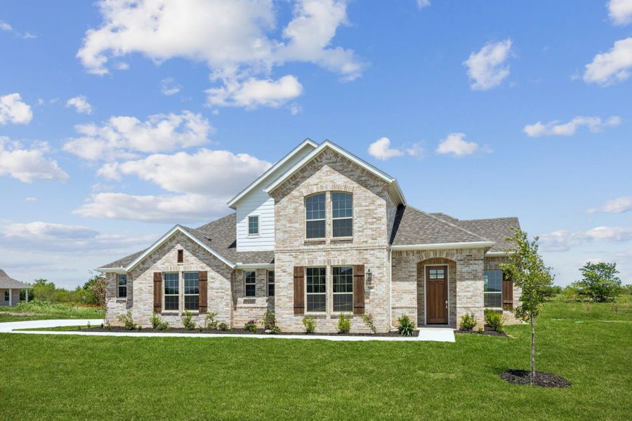 Front exterior of a new home in Ellis Ranch Estates, Waxahachie, TX, highlighting curb appeal (Image 2). Front exterior of a new home in Ellis Ranch Estates, Waxahachie, TX, highlighting curb appeal (Image 2).