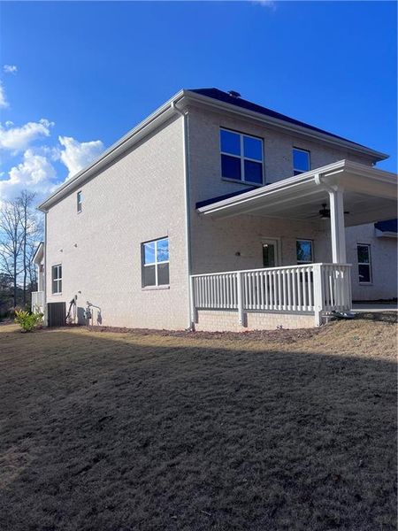 Exterior details and patio area of a home in Mirror Lake at South Harbour, Villa Rica (Image 19).