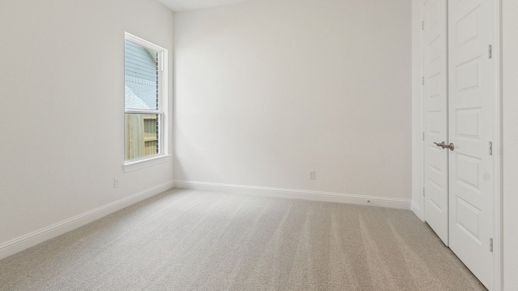 Representative furnished interior of a home built from the Vanderbilt by DRB Homes in Creekhaven, Iowa Colony (Image 16).