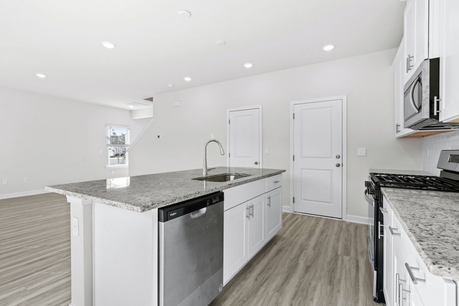 The stunning open-concept floorplan allows for easy flow between the kitchen and dining areas. The stunning open-concept floorplan allows for easy flow between the kitchen and dining areas.