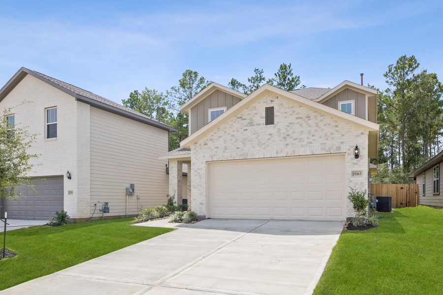Front exterior of a new home in Magnolia Springs, Montgomery, TX, highlighting curb appeal (Image 2). Front exterior of a new home in Magnolia Springs, Montgomery, TX, highlighting curb appeal (Image 2).