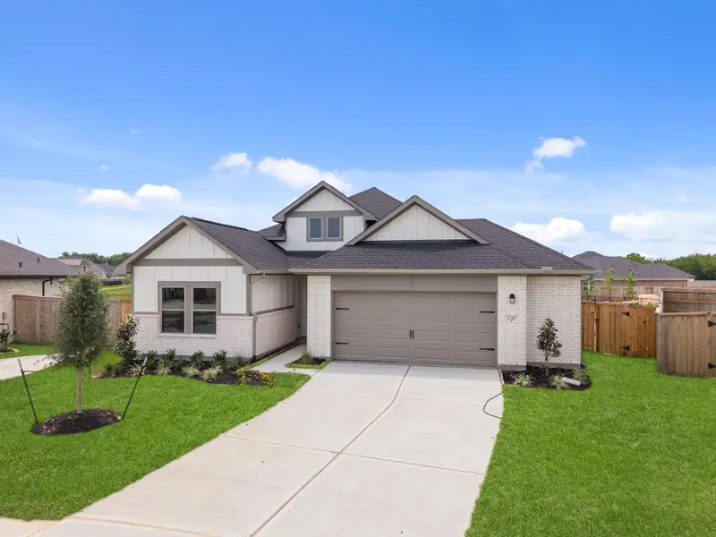 Front exterior of a new home in Laurel Landing, Alvin, TX, highlighting curb appeal (Image 2). Front exterior of a new home in Laurel Landing, Alvin, TX, highlighting curb appeal (Image 2).