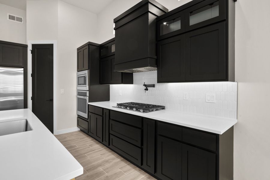 Representative furnished interior of a home built from the Pebble Beach- II by LEH. Homes in Verdancia, El Paso (Image 17).