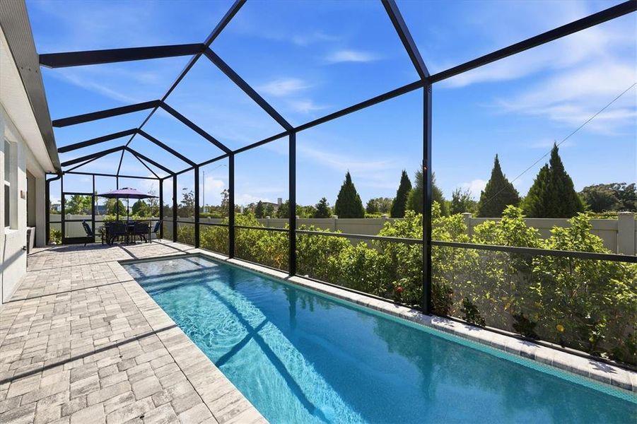 Exterior details and patio area of a home in Bella Lago, Parrish (Image 3).