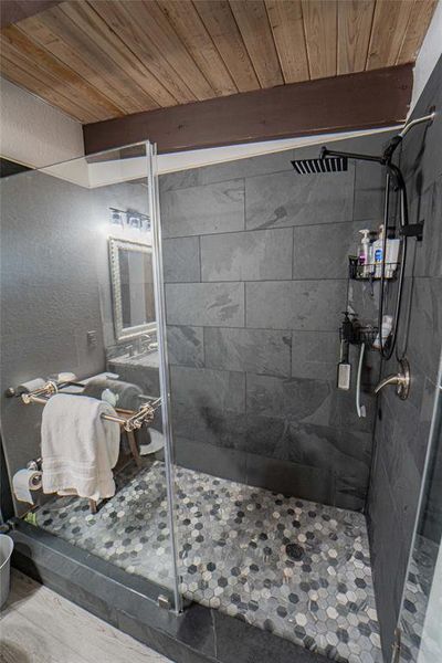 Walk-in shower with modern tile finish Walk-in shower with modern tile finish