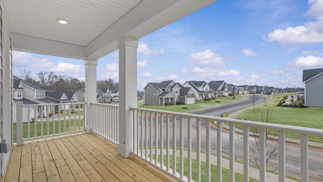 The second-story front balcony delivers a first-rate outdoor escape with elevated views.