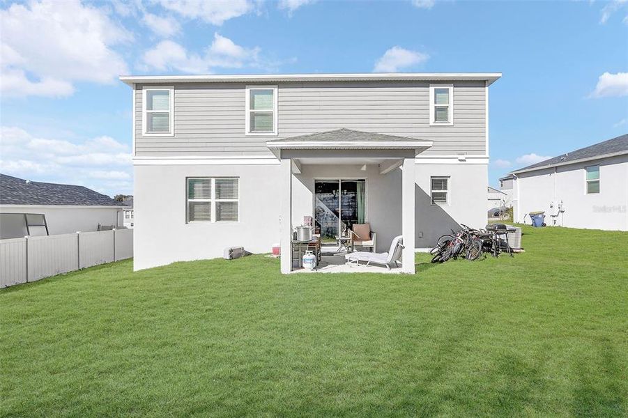 Exterior details and patio area of a home in The Reserve at Lake Ridge, Minneola (Image 29).