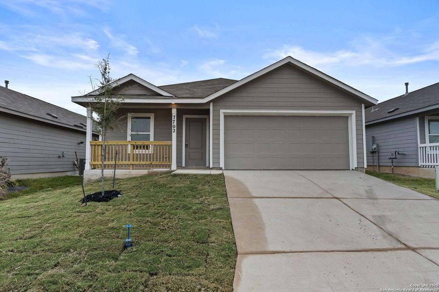 Front exterior of a new home in , Floresville, TX, highlighting curb appeal (Image 1).