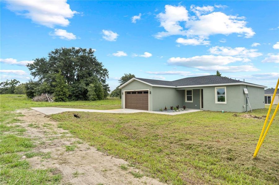 Front exterior of a new home in , Dunnellon, FL, highlighting curb appeal (Image 20).