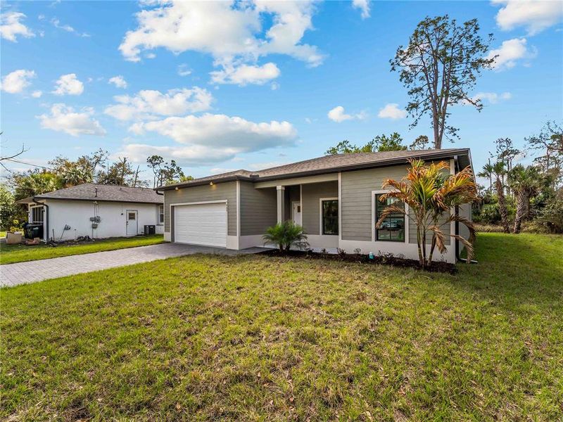Exterior details and patio area of a home in , North Port (Image 36).