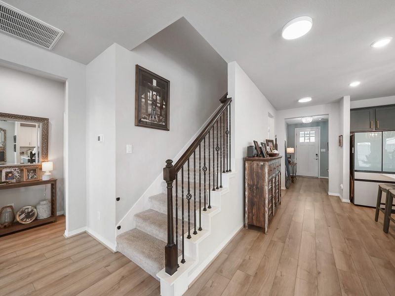 The upstairs landing offers a seamless transition into the second level, with an open feel that connects each space with ease.