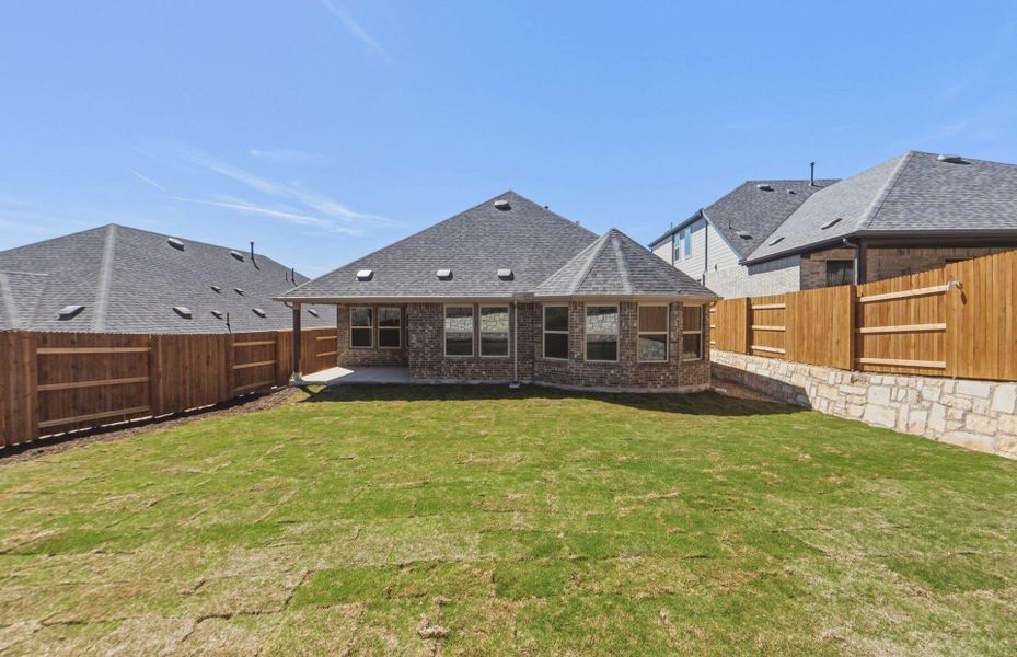 Exterior details and patio area of a home in West Cypress Hills, Spicewood (Image 4).