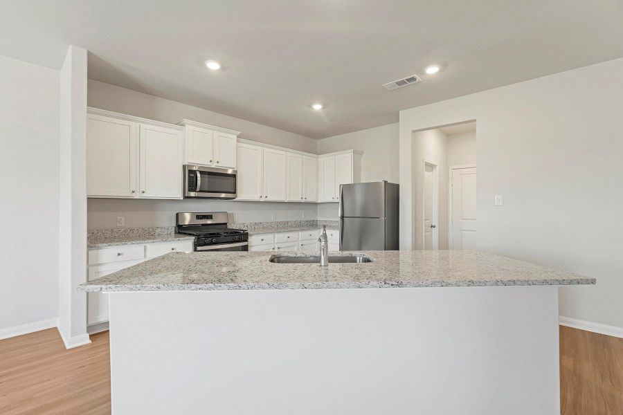 Furnished interior view inside a new home in Canterra Creek, Iowa Colony (Image 4).