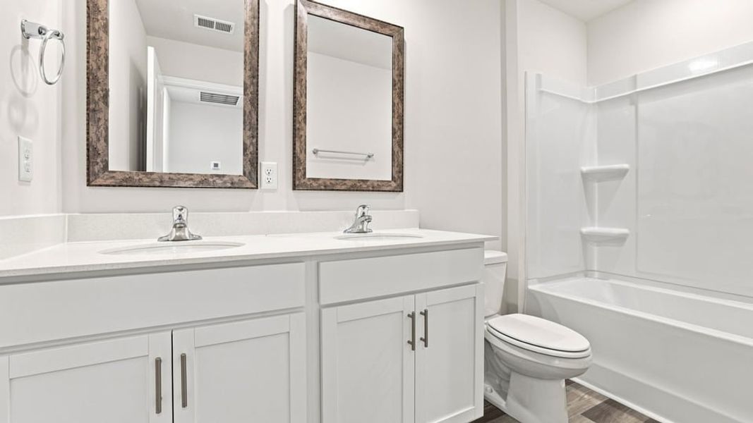 Furnished interior view inside a new home in Lakestone, Woodruff (Image 11).