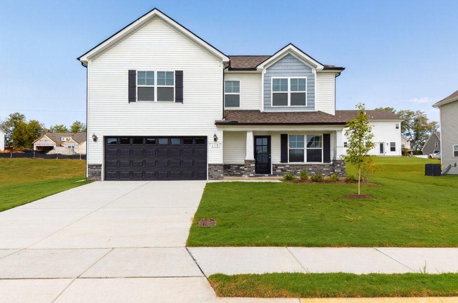 Front exterior of a new home in Wheatfield, Shelbyville, TN, highlighting curb appeal (Image 1). Front exterior of a new home in Wheatfield, Shelbyville, TN, highlighting curb appeal (Image 1).