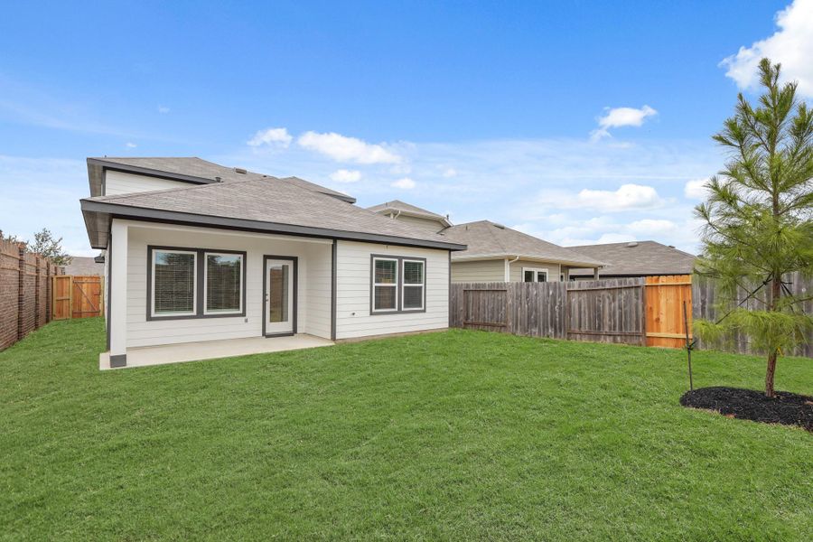 Exterior details and patio area of a home in Presswoods, Splendora (Image 4).