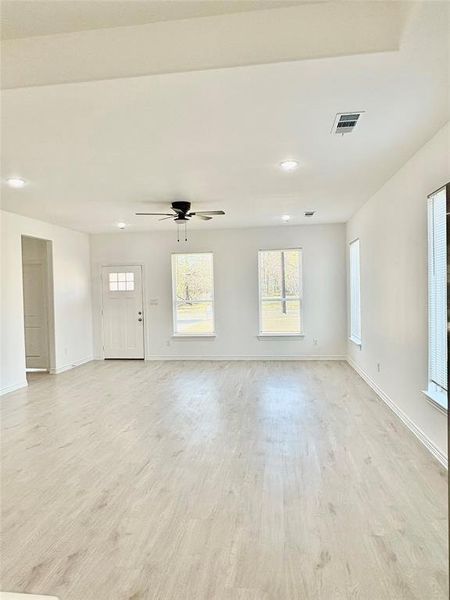 Unfurnished living room featuring recessed lighting, light wood finished floors, and a ceiling fan