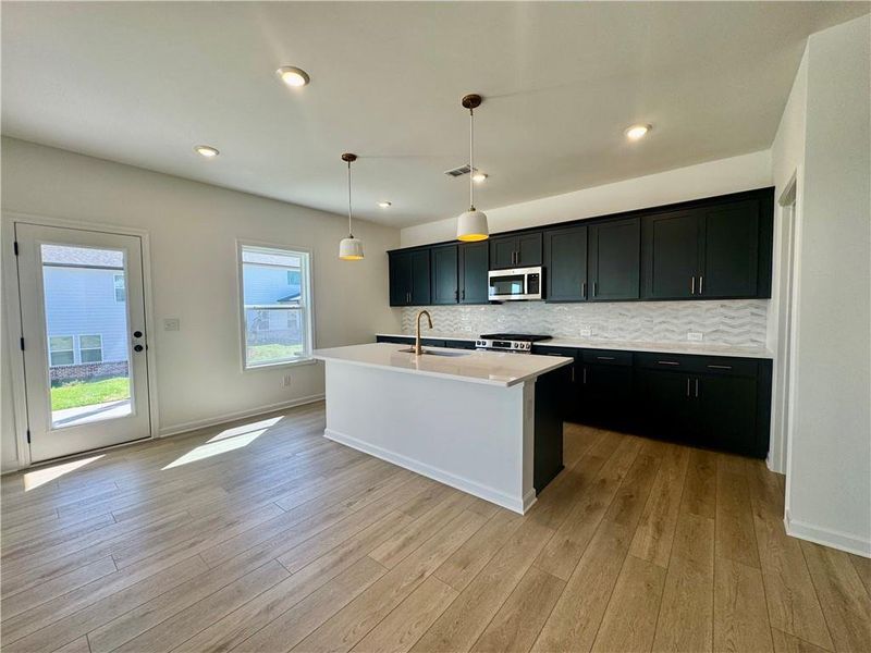 Furnished interior view inside a new home in Eastlyn Crossing, Flowery Branch (Image 8).