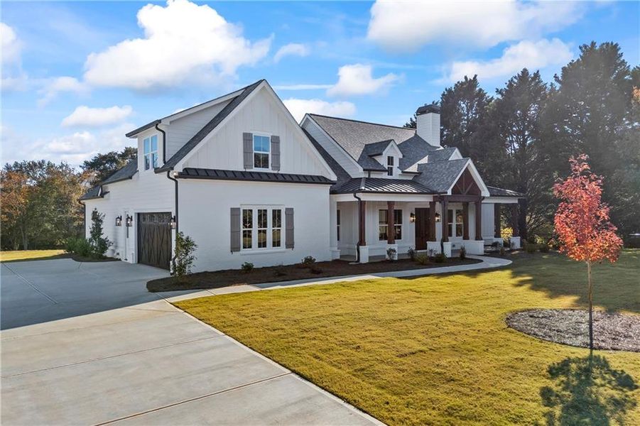 Front exterior of a new home in , Monroe, GA, highlighting curb appeal (Image 1).