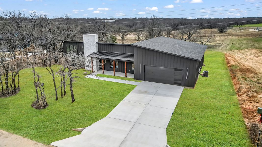 Representative exterior photo of a completed home built from the Zephyer 2 by Zeal Home Builders in Parallel Pastures, Poolville, TX (Image 24).