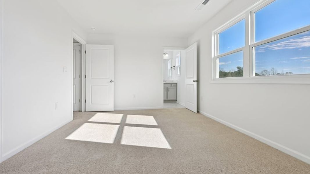 Representative unfurnished interior of a home built from the Wylie by D.R. Horton in Eagle Creek, Fuquay Varina (Image 26).