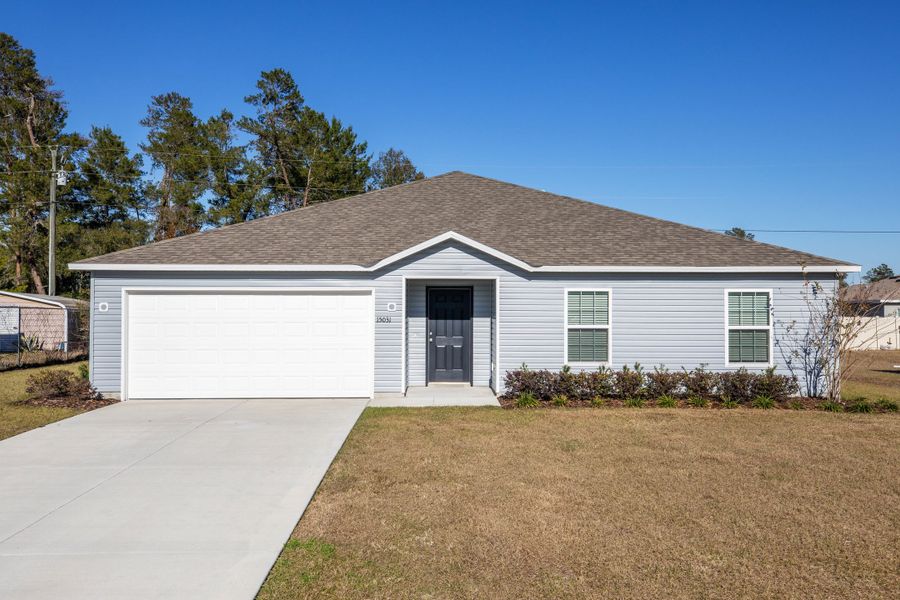 Front exterior of a new home in Royal Highlands, Brooksville, FL, highlighting curb appeal (Image 25). Front exterior of a new home in Royal Highlands, Brooksville, FL, highlighting curb appeal (Image 25).