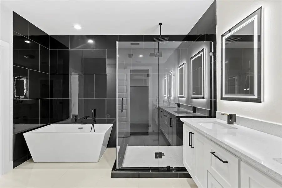 Bathroom with tile patterned flooring, vanity, and independent shower and bath