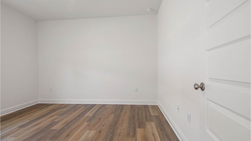 Representative unfurnished interior of a home built from the Delray by D.R. Horton in Caballeros Estates At Hombre, Panama City Beach (Image 17).