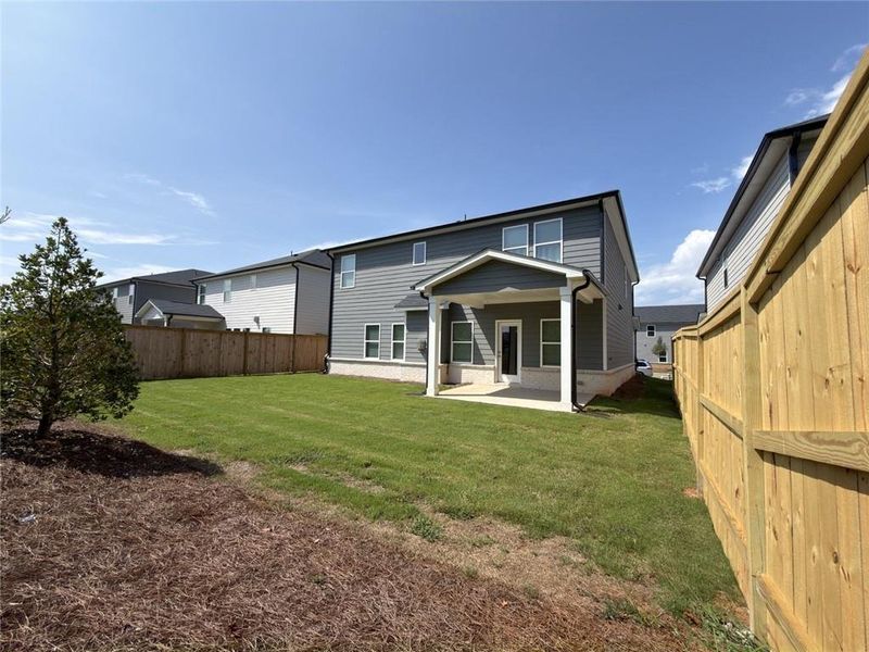 Exterior details and patio area of a home in Martin Springs - Estate Series, Lawrenceville (Image 19).