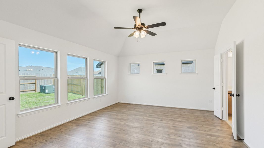 Furnished interior view inside a new home in Sunterra, Katy (Image 7).