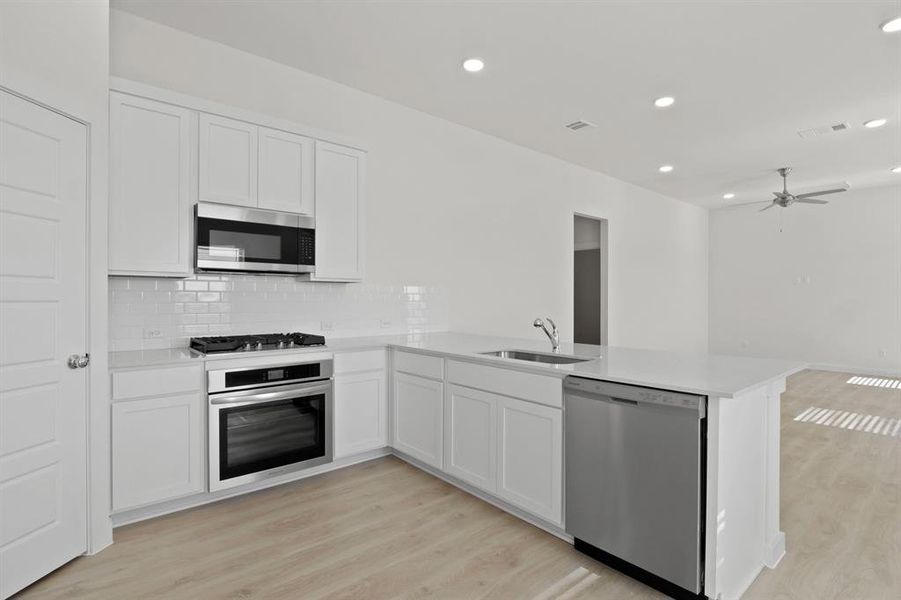 Furnished interior view inside a new home in Lowry Trails, Princeton (Image 5).