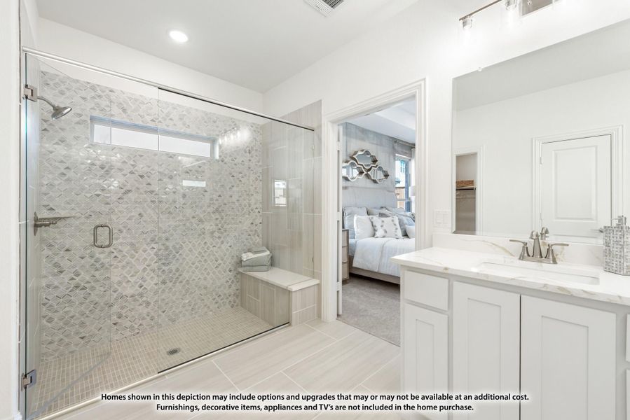 Ensuite bathroom with glass walk-in shower, decorative tile walls, built-in bench, and white vanity with marble countertop Ensuite bathroom with glass walk-in shower, decorative tile walls, built-in bench, and white vanity with marble countertop