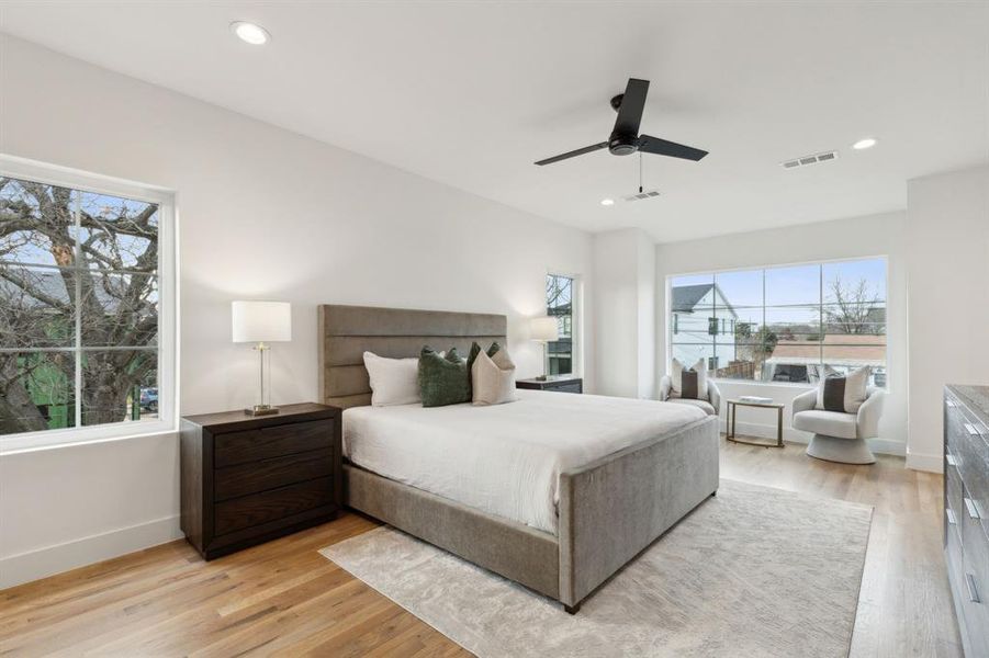 Bedroom featuring ceiling fan and light wood-type flooring