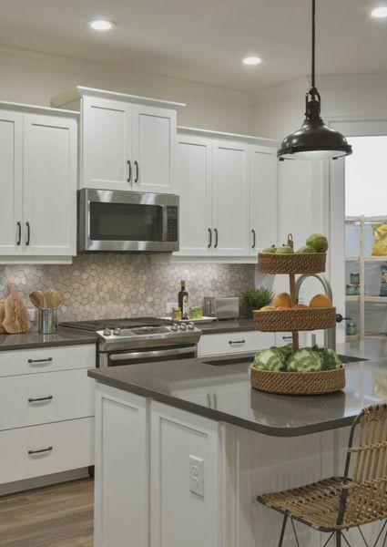 Representative furnished interior of a home built from the Lighthouse by Neal Communities in SkySail, Naples (Image 6).