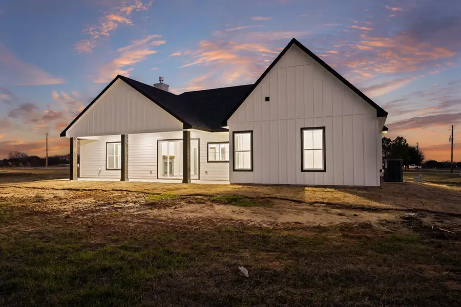 Exterior details and patio area of a home in , New Waverly (Image 3).