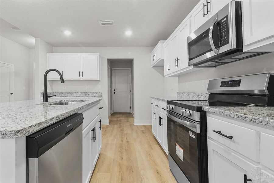 Furnished interior view inside a new home in Pecan Valley, Cantonment (Image 5).